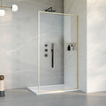 Modern shower setup with glass enclosure and plumbing fixtures in a bright bathroom.