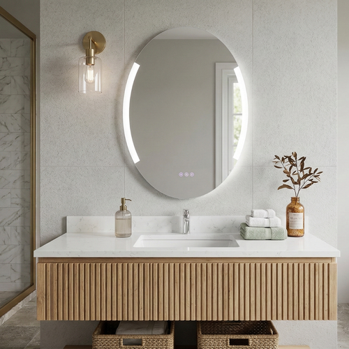 Bathroom vanity with round mirror, light fixture, and decorative elements.