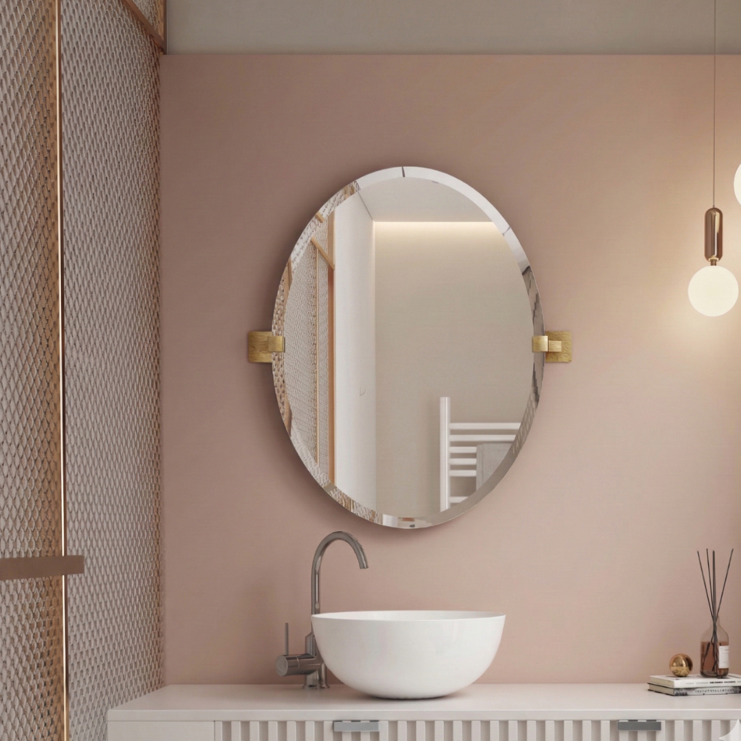 Bathroom with round mirror, sink, and decorative elements on a pink wall.