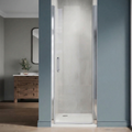 Modern bathroom with a shower enclosure and wooden cabinet.