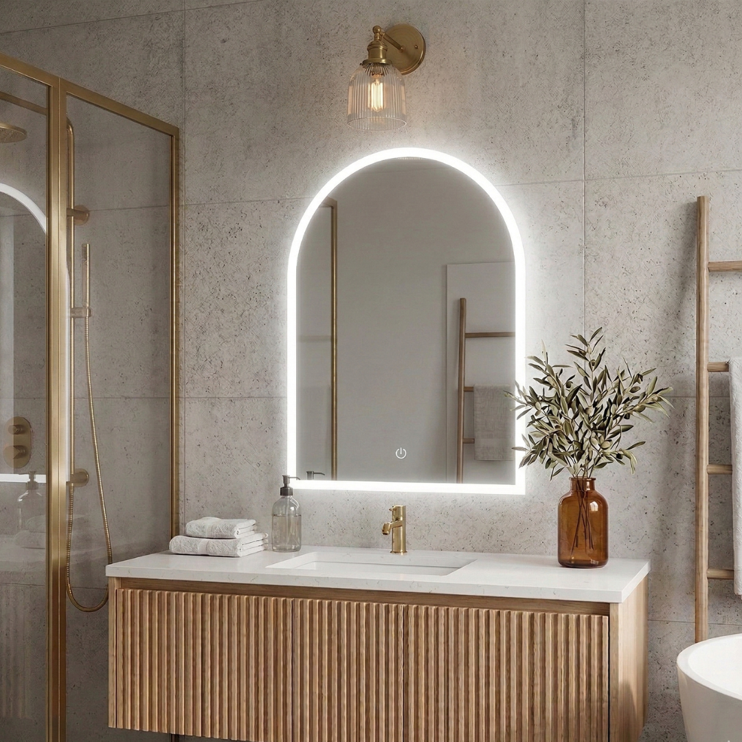 Bathroom with a vanity, sink, and illuminated mirror.