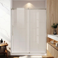Bathroom with a glass shower enclosure, wooden cabinet, and marble wall.