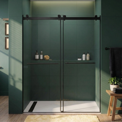 Modern bathroom with a green tiled wall and glass shower enclosure.