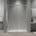 Modern bathroom with a glass shower enclosure, sink, and decor.