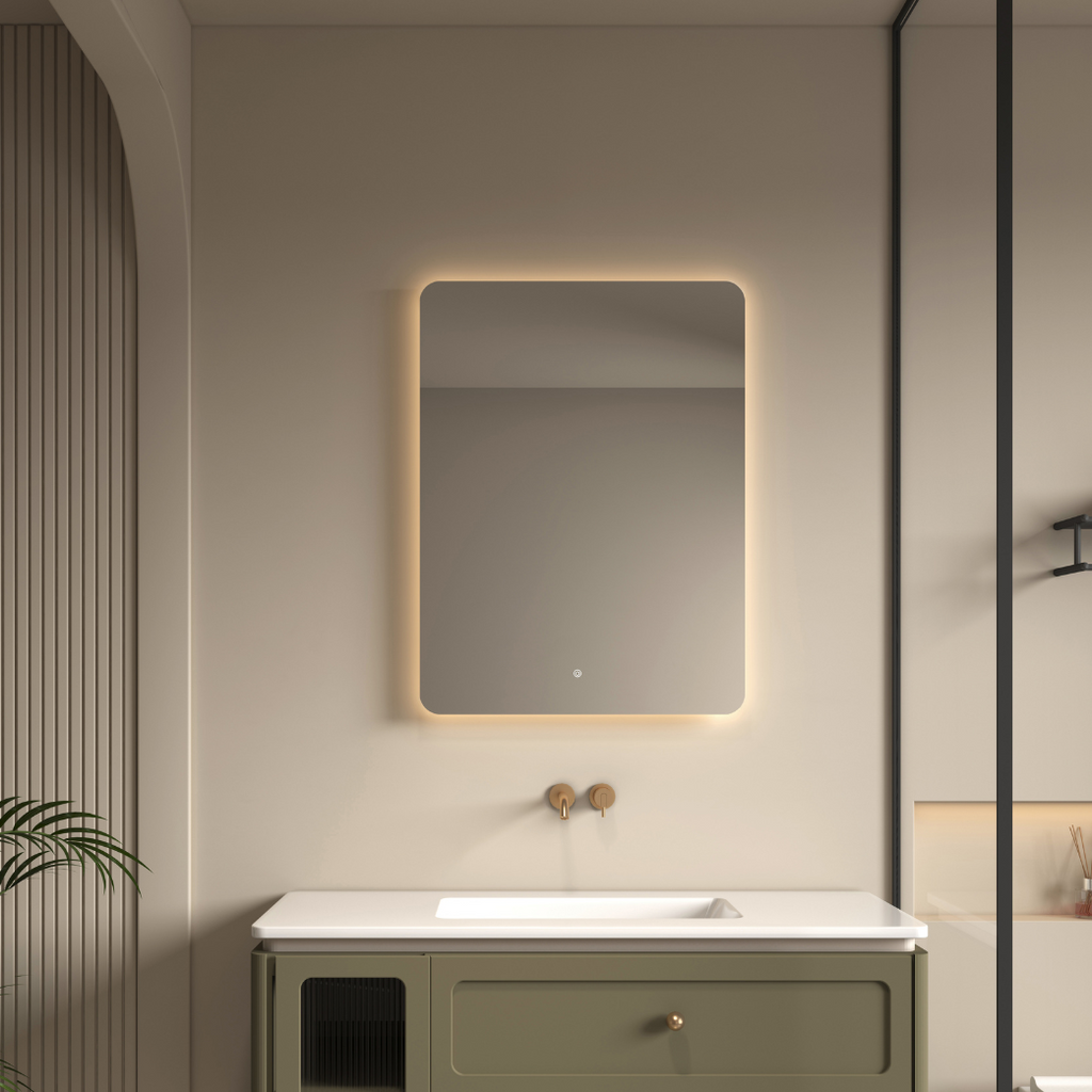 Bathroom with a vanity unit and illuminated mirror