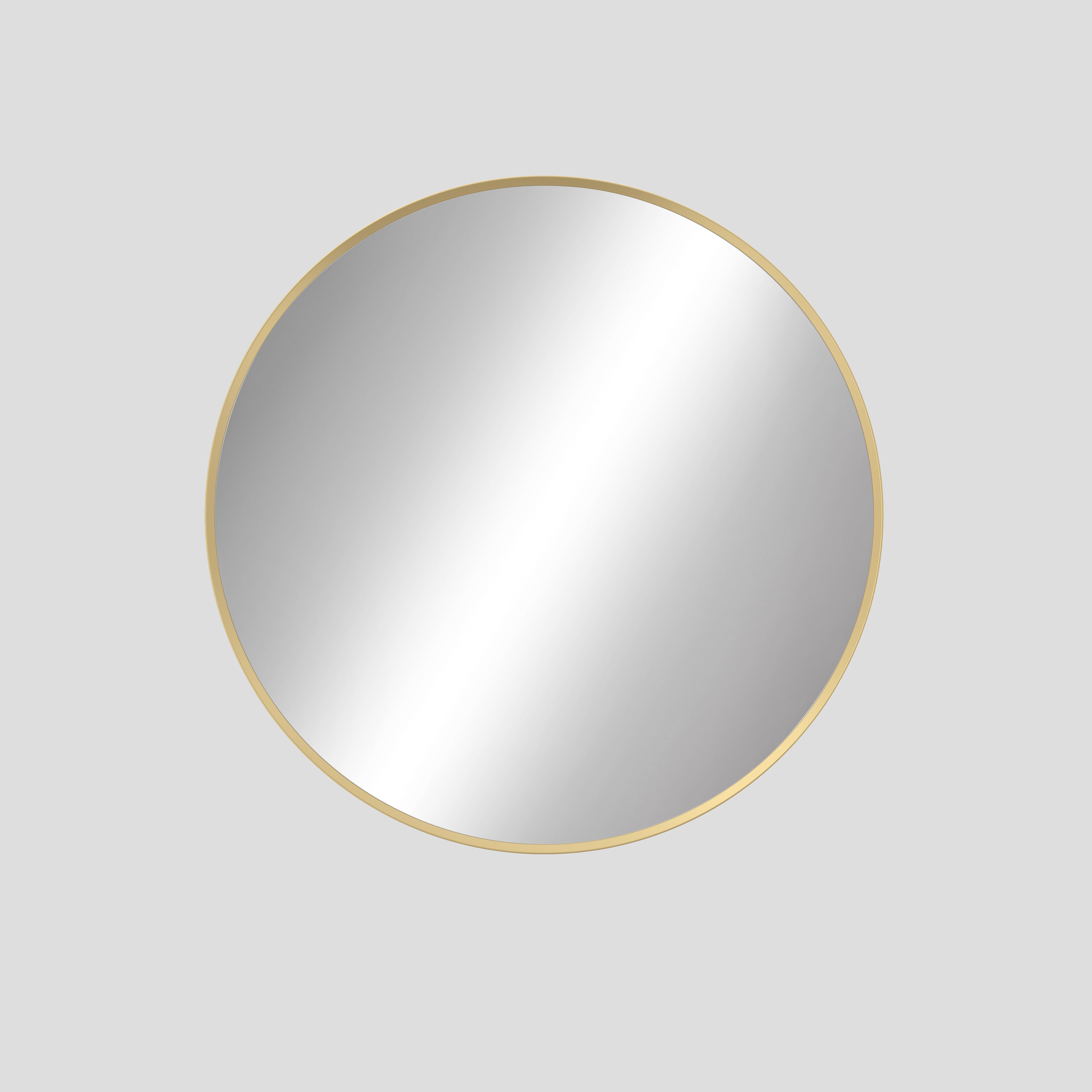 Round mirror with a gold frame on a light gray background