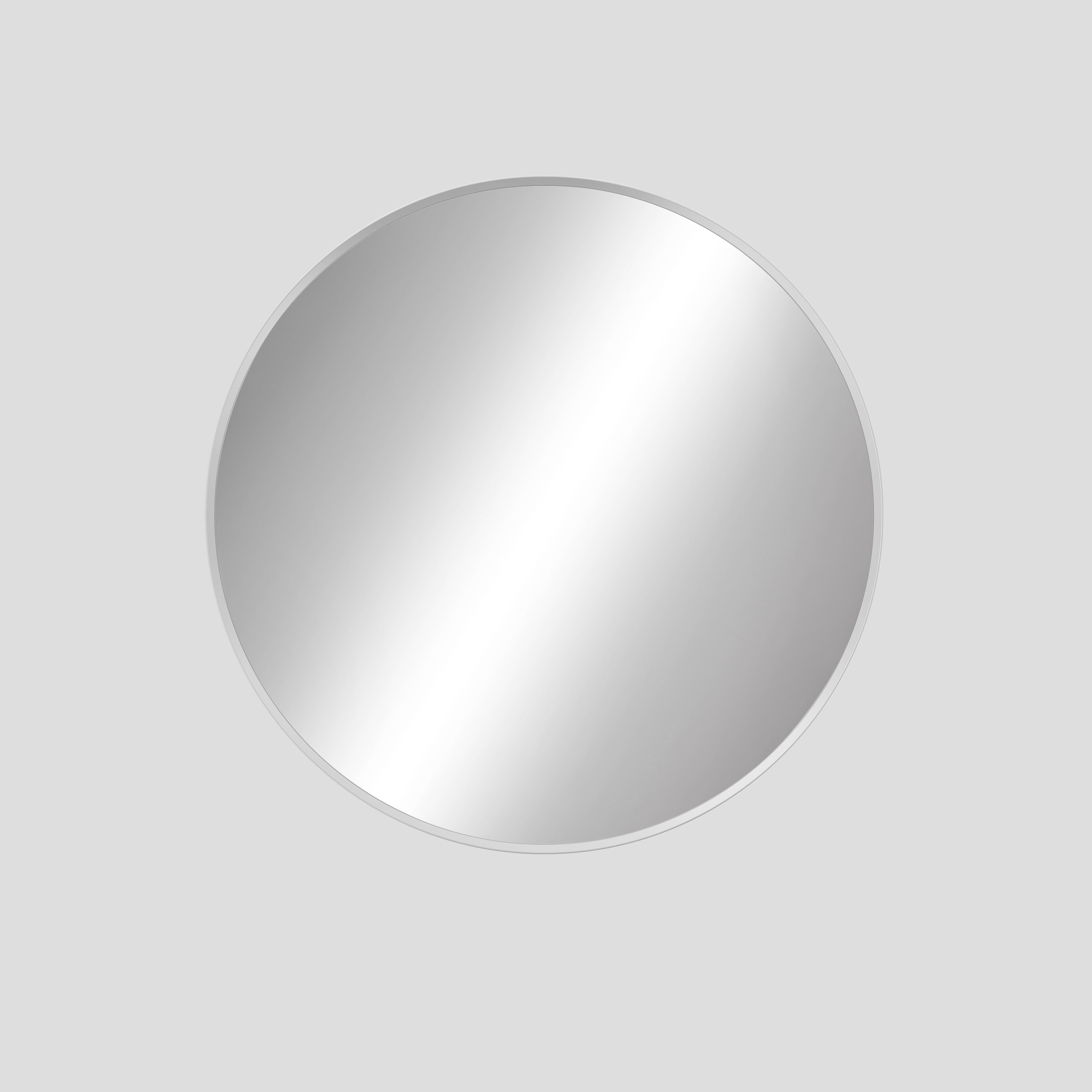Round silver mirror on a light gray background