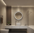 Modern bathroom with round illuminated mirror, sink, and shower.
