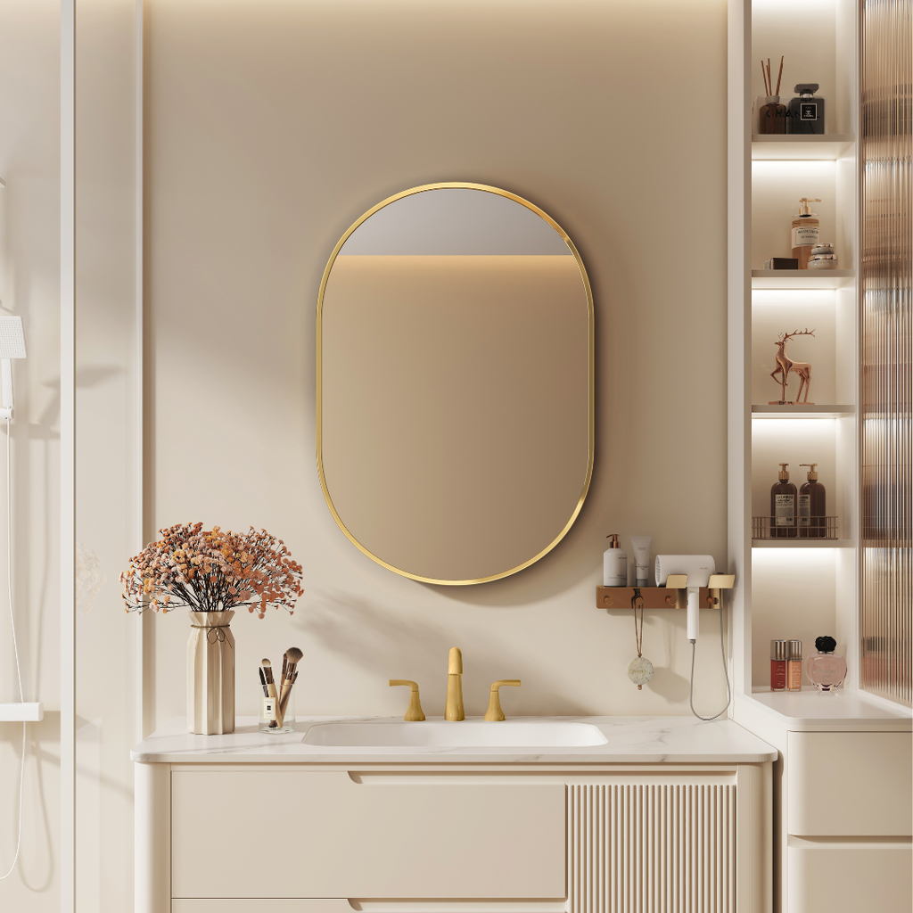 Modern bathroom vanity with gold-framed mirror and decorative elements.