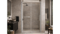 Modern bathroom with a shower enclosure, sink, and various decor elements.