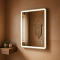 Bathroom mirror with LED lighting on a brown tiled wall