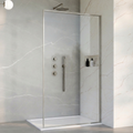 Modern shower enclosure with glass door and shower fixtures in a bathroom setting.