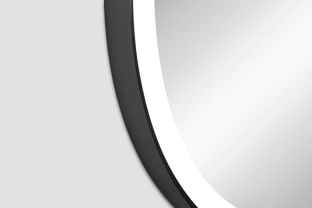 Round mirror with black frame on a white background