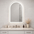 Bathroom vanity with a large illuminated mirror above the sink.