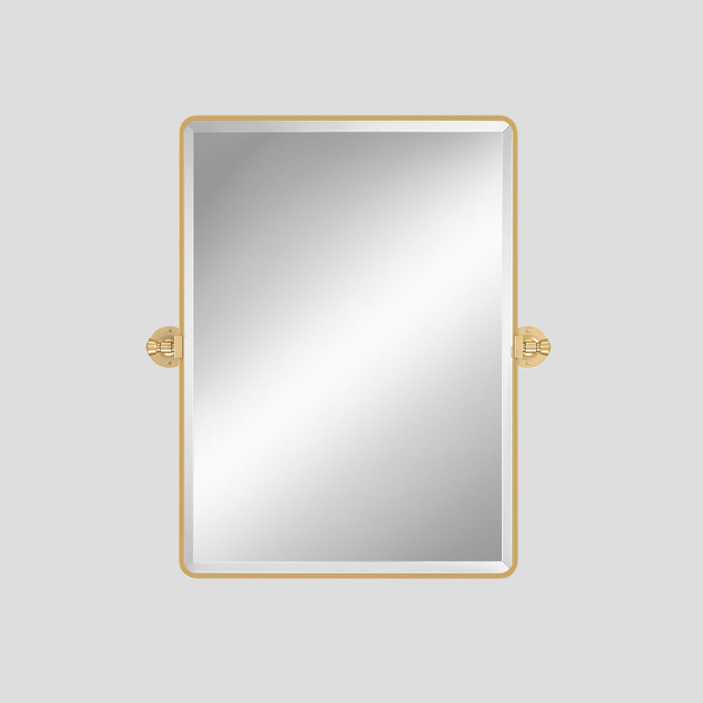 Rectangular mirror with gold frame on a light gray background