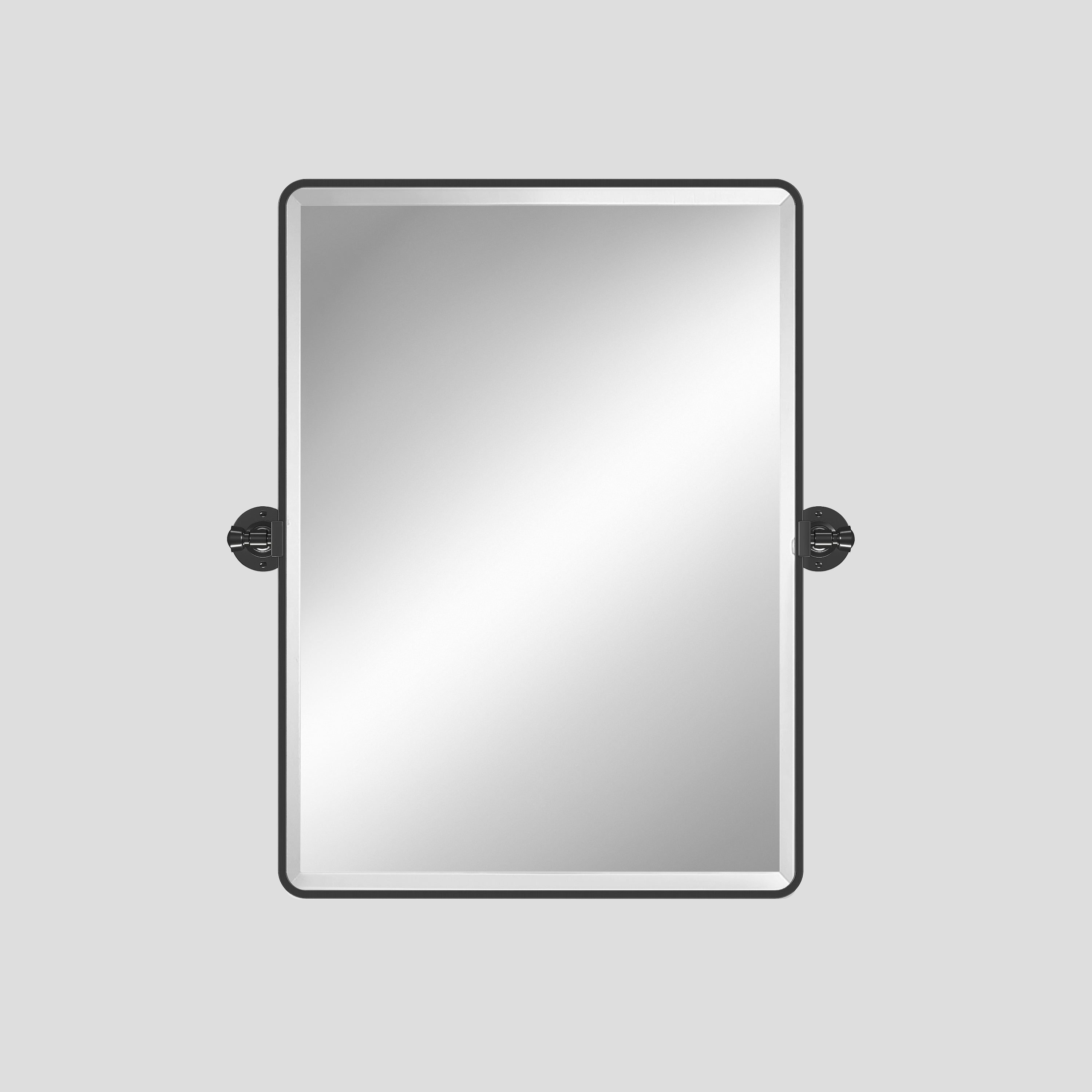 Rectangular mirror with black frame on a light gray background