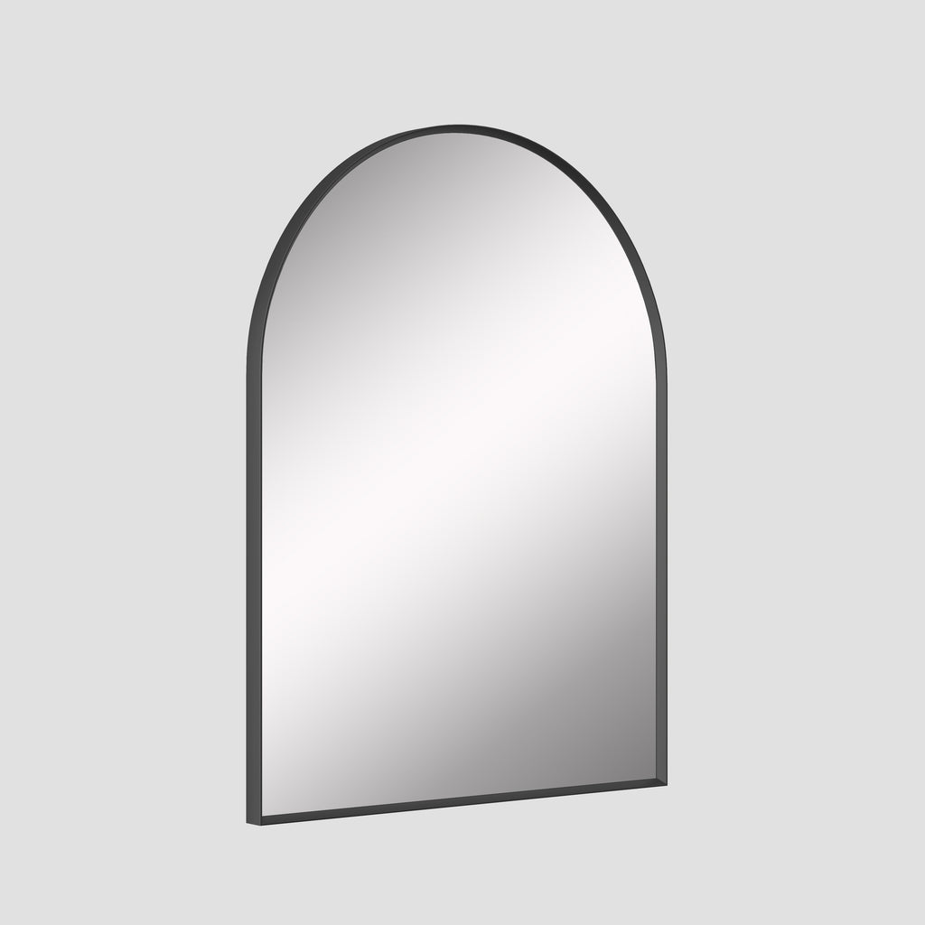 Arched mirror with black frame on a light gray background