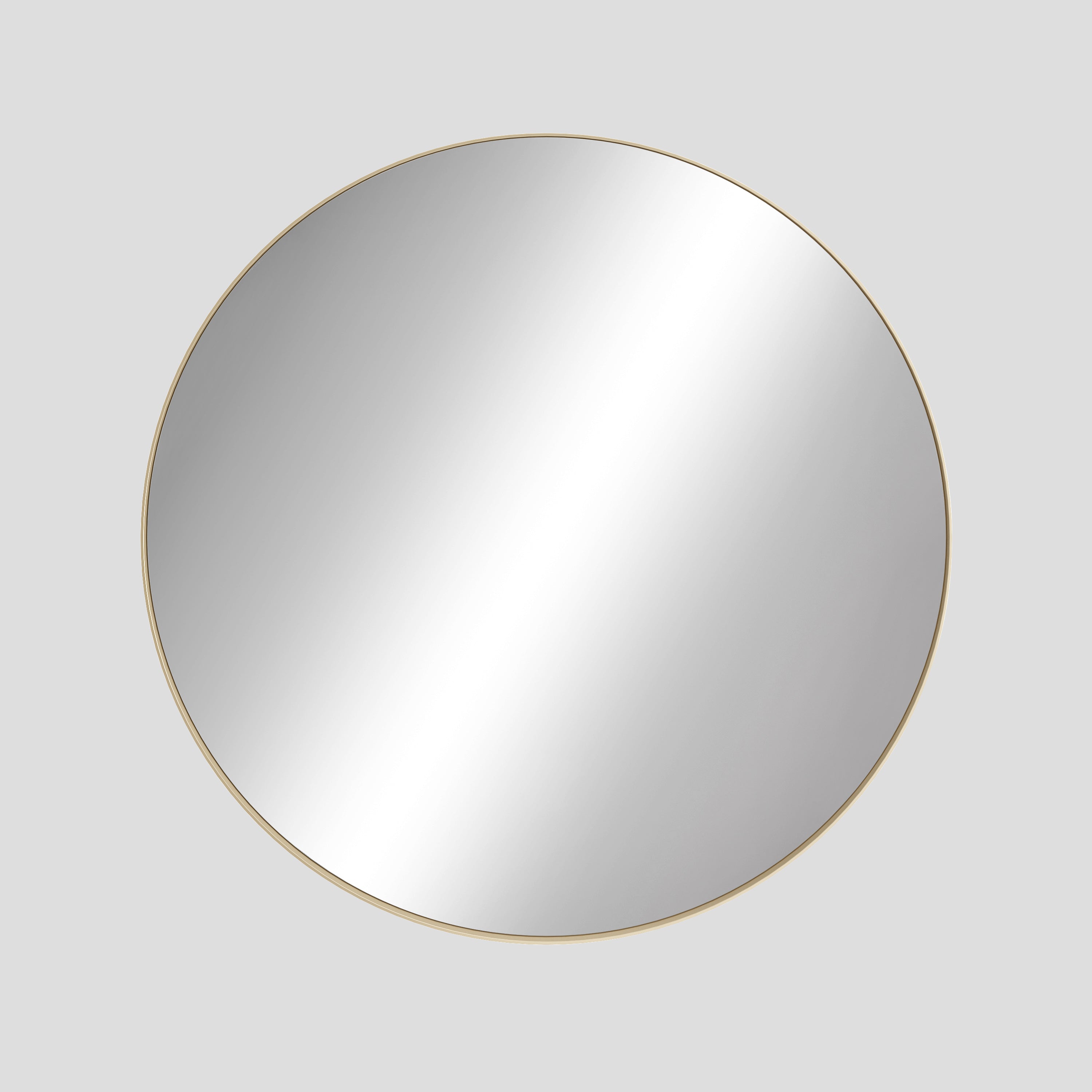 Round mirror with a gold frame on a light gray background