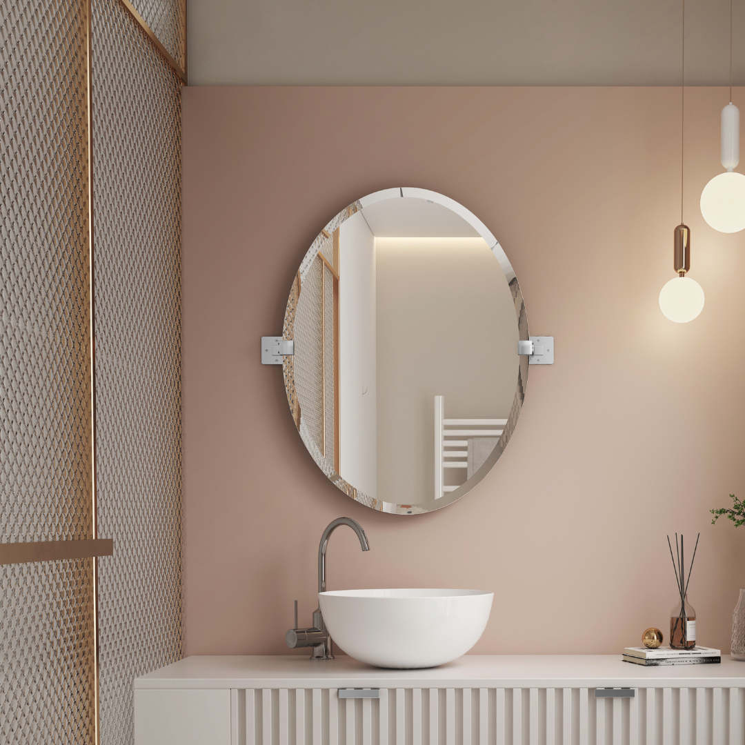 Bathroom with round mirror, sink, and decorative elements on a pink wall.