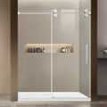Modern glass shower enclosure with a shelf inside, set against a neutral bathroom wall.