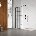 Modern bathroom with a glass shower enclosure, shower head, and control handle.