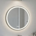 Round illuminated bathroom mirror on a light gray wall
